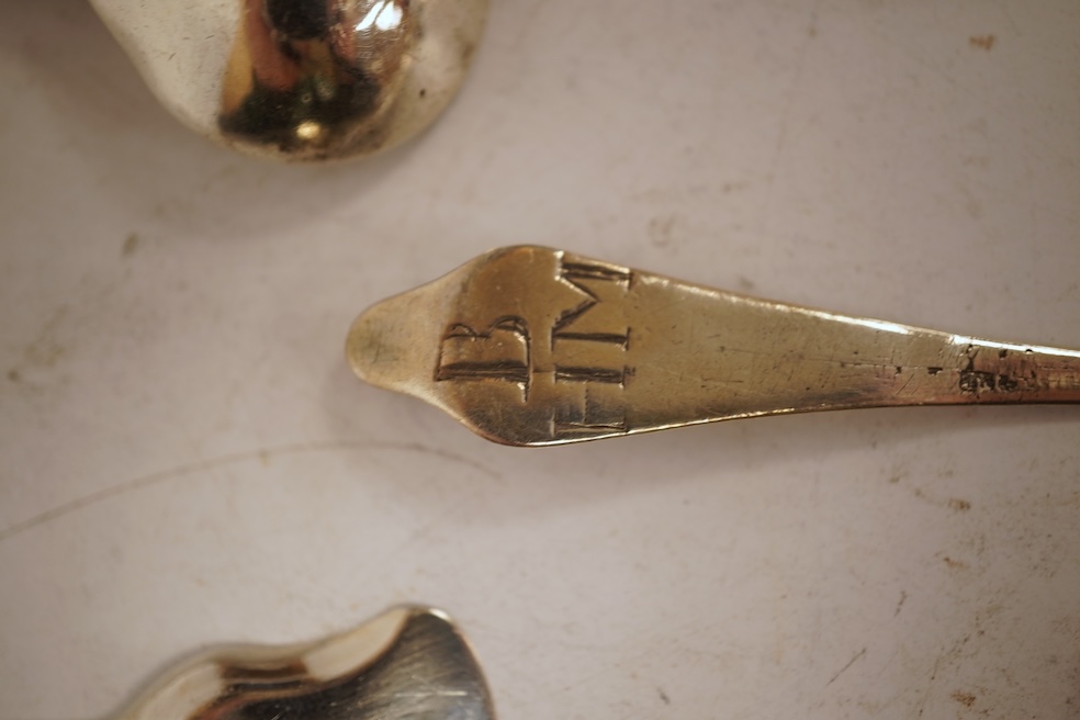 A small collection of nine assorted Georgian and later small silver or white metal spoons, including mustard ladles and other condiment spoons, a caddy spoon, London, 1799, together with a 19th century Russian 84 zolotni